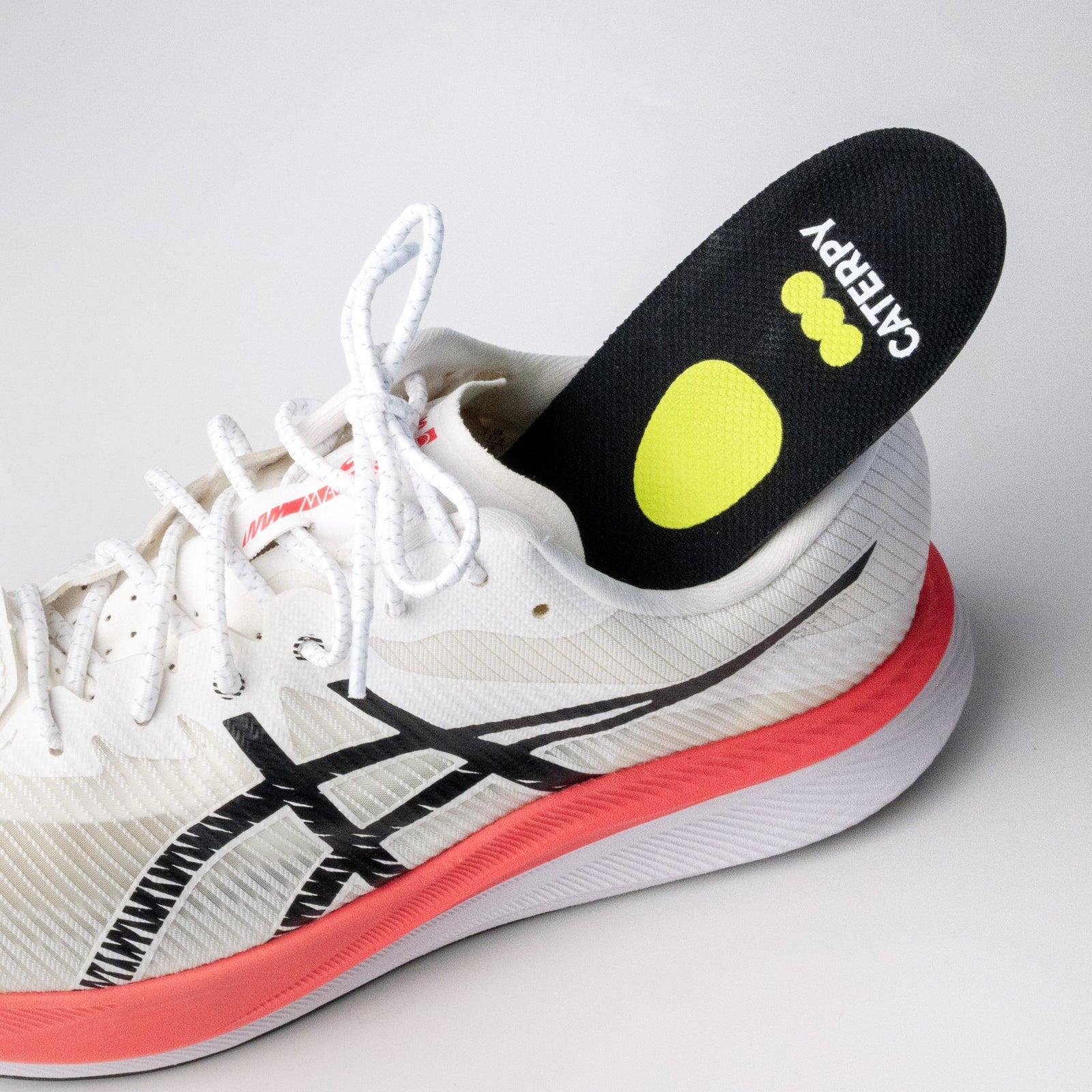 Caterpy Cuboid Support Insole sitting in a running shoe